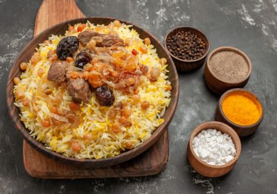 side-close-up-view-spices-pilaf-board-bowls-colorful-spices-1